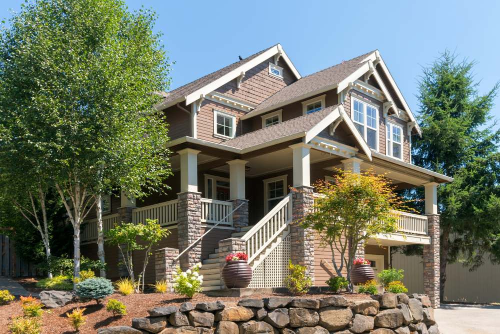 Blu Masonry team consulting homeowner on outdoor hardscaping project in Massachusetts