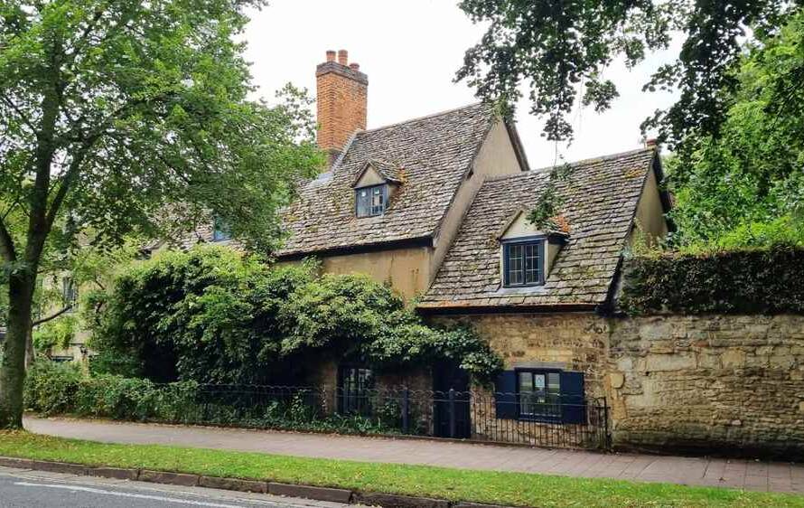 Expert mason restoring brick chimney on historic Massachusetts home
