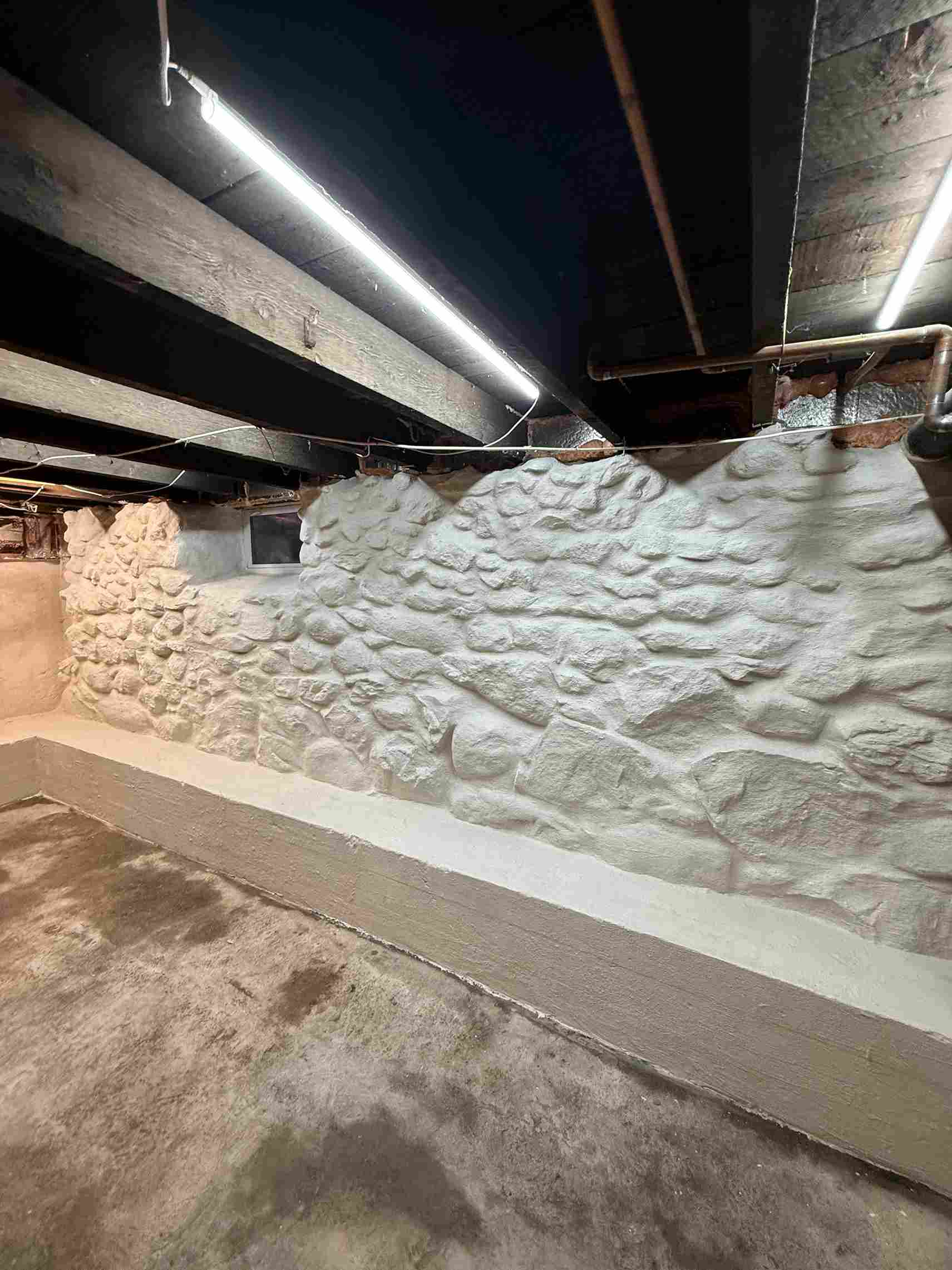 Basement waterproofing and stone foundation parging in Massachusetts