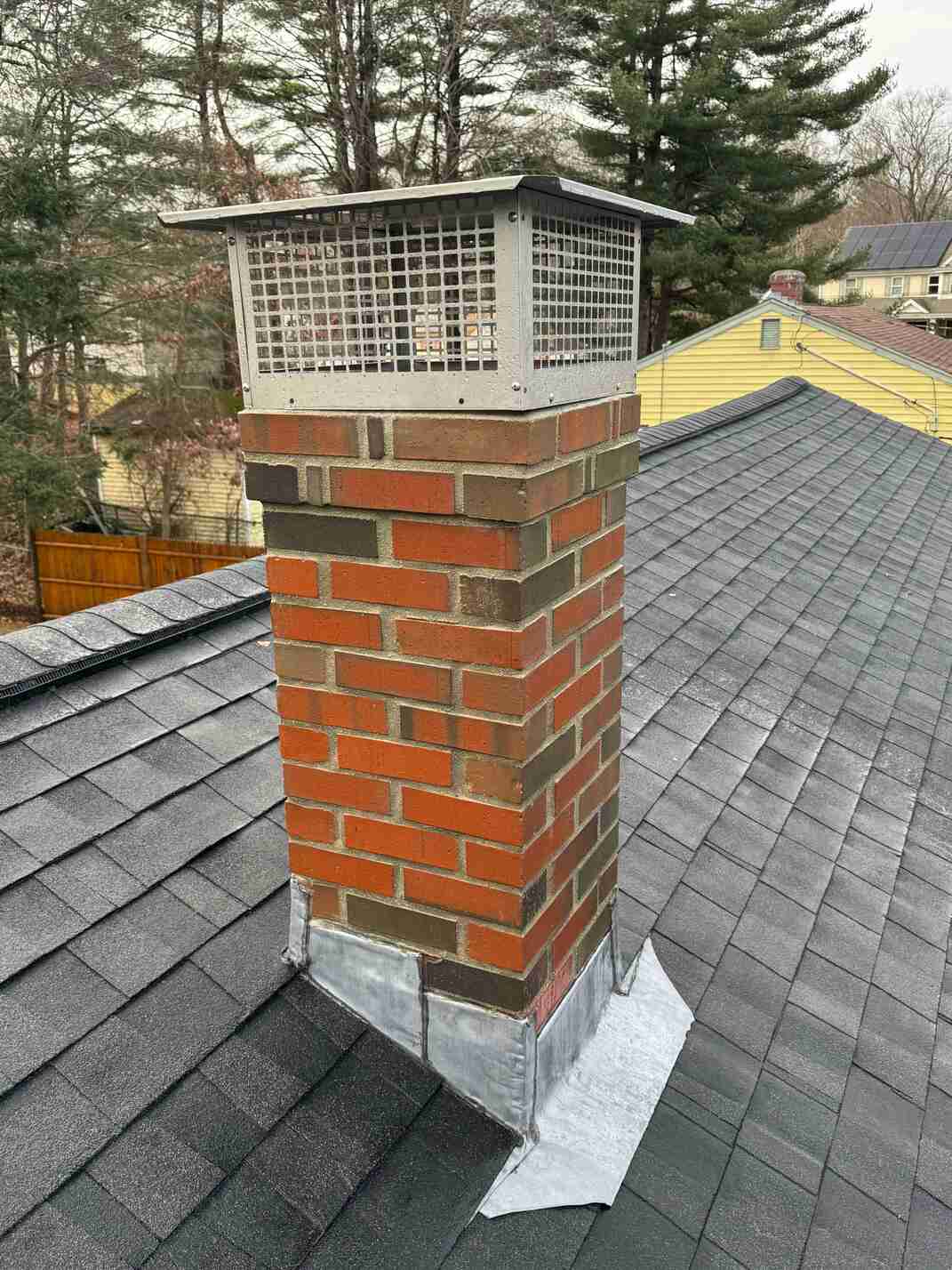 Chimney repair with flashing and cap in Massachusetts