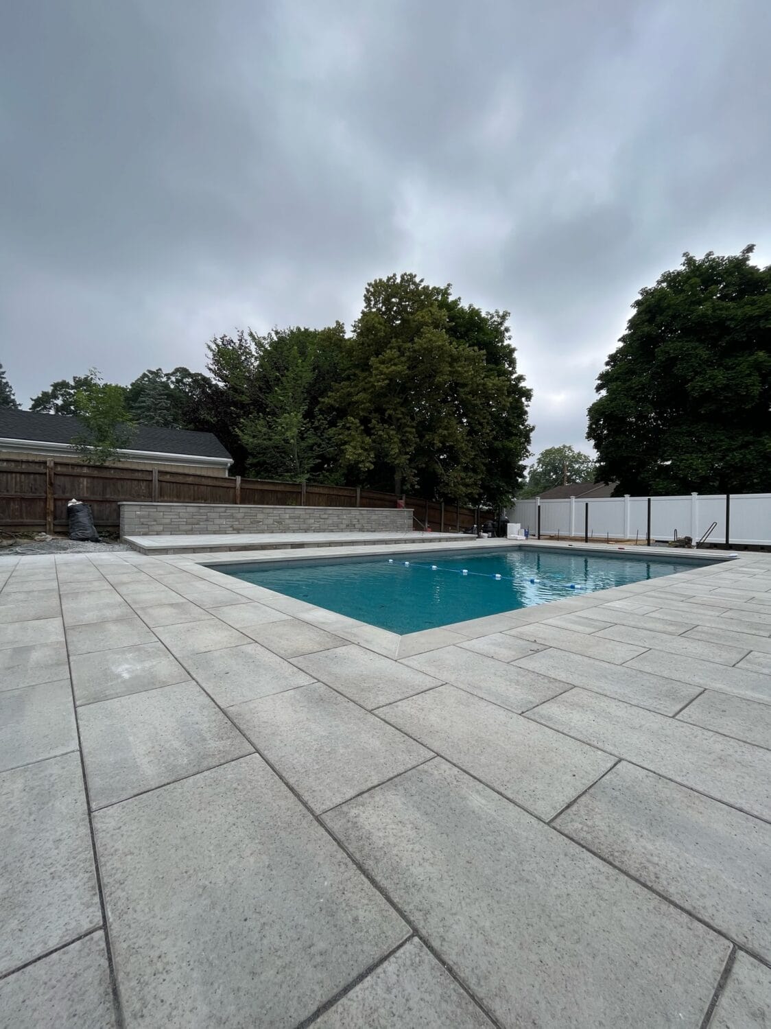 New concrete slabs around a pool